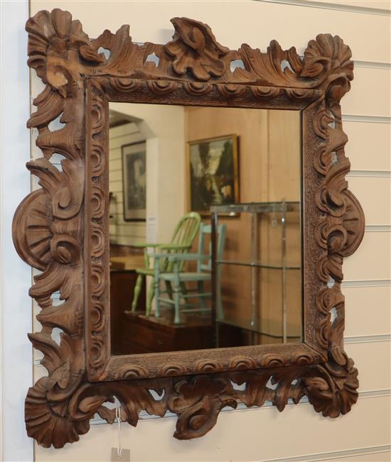 A Continental carved wood wall mirror H.66cm
